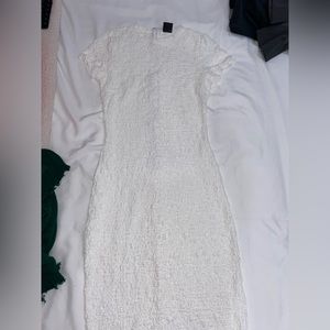 Long white lace type dress.